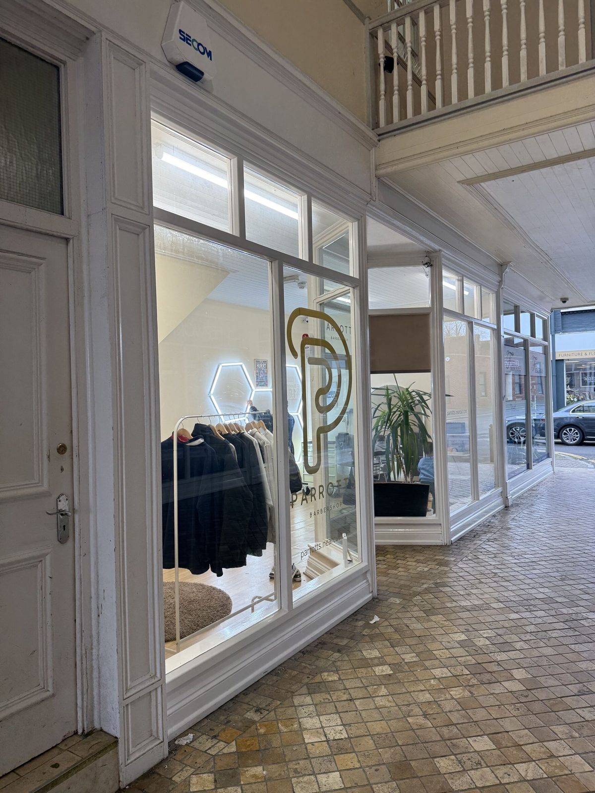 The PARROTTS window in Queens Walk with the P logo on the glass
